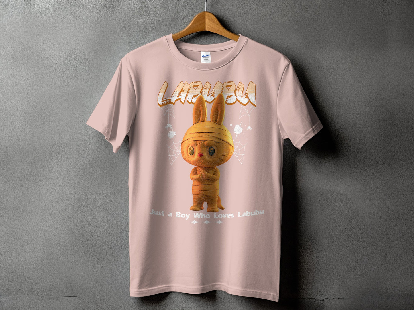 Pink t-shirt with Labubu text and a mummy-like Labubu character.