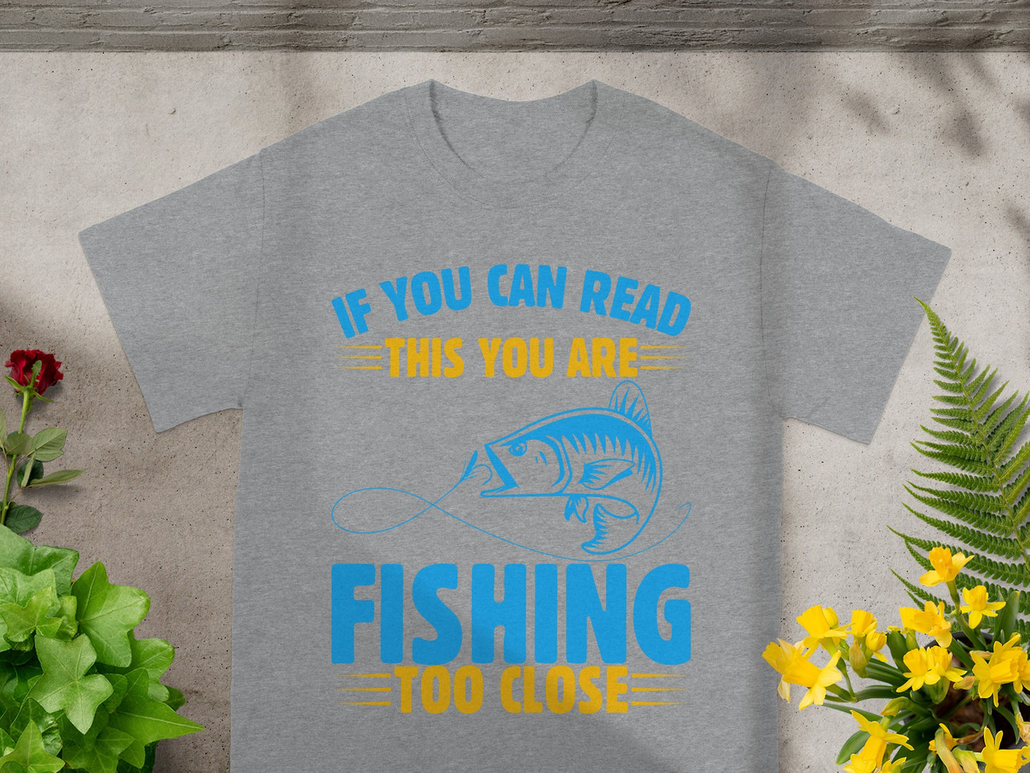 Grey t-shirt with blue and yellow text and a fish graphic.