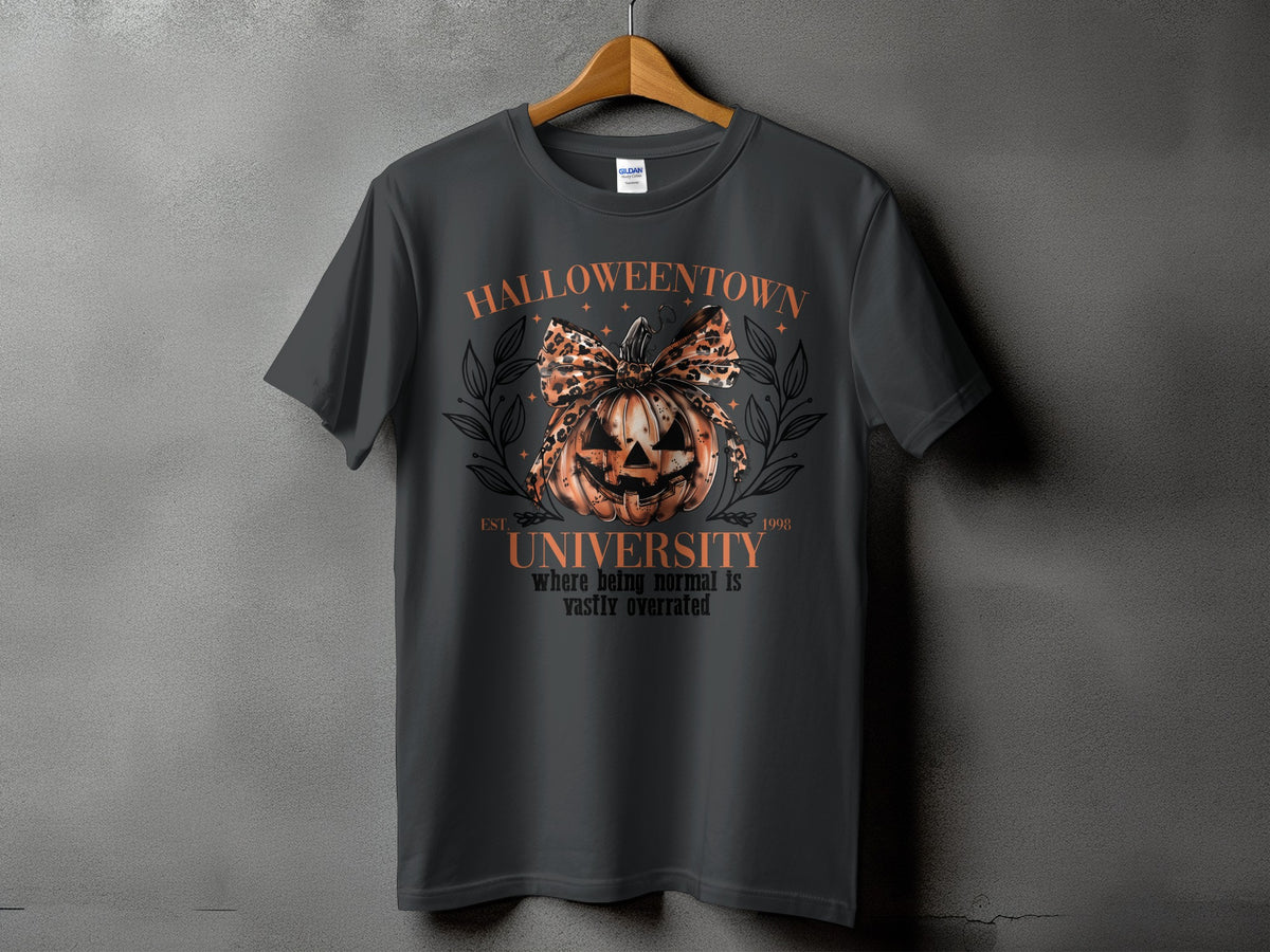 Dark gray t-shirt with Halloween graphic featuring a pumpkin, leopard bow, and text.
