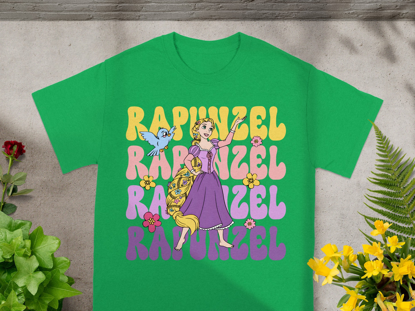 Green t-shirt with "Rapunzel" text in colorful retro font and Rapunzel character.