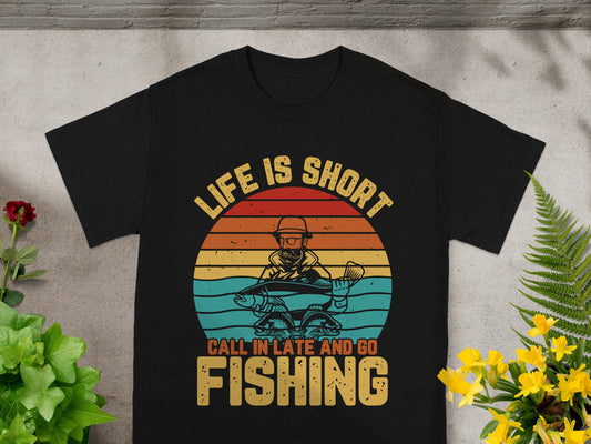 T-shirt with retro fishing graphic and text "Life is Short Call in Late and Go Fishing."