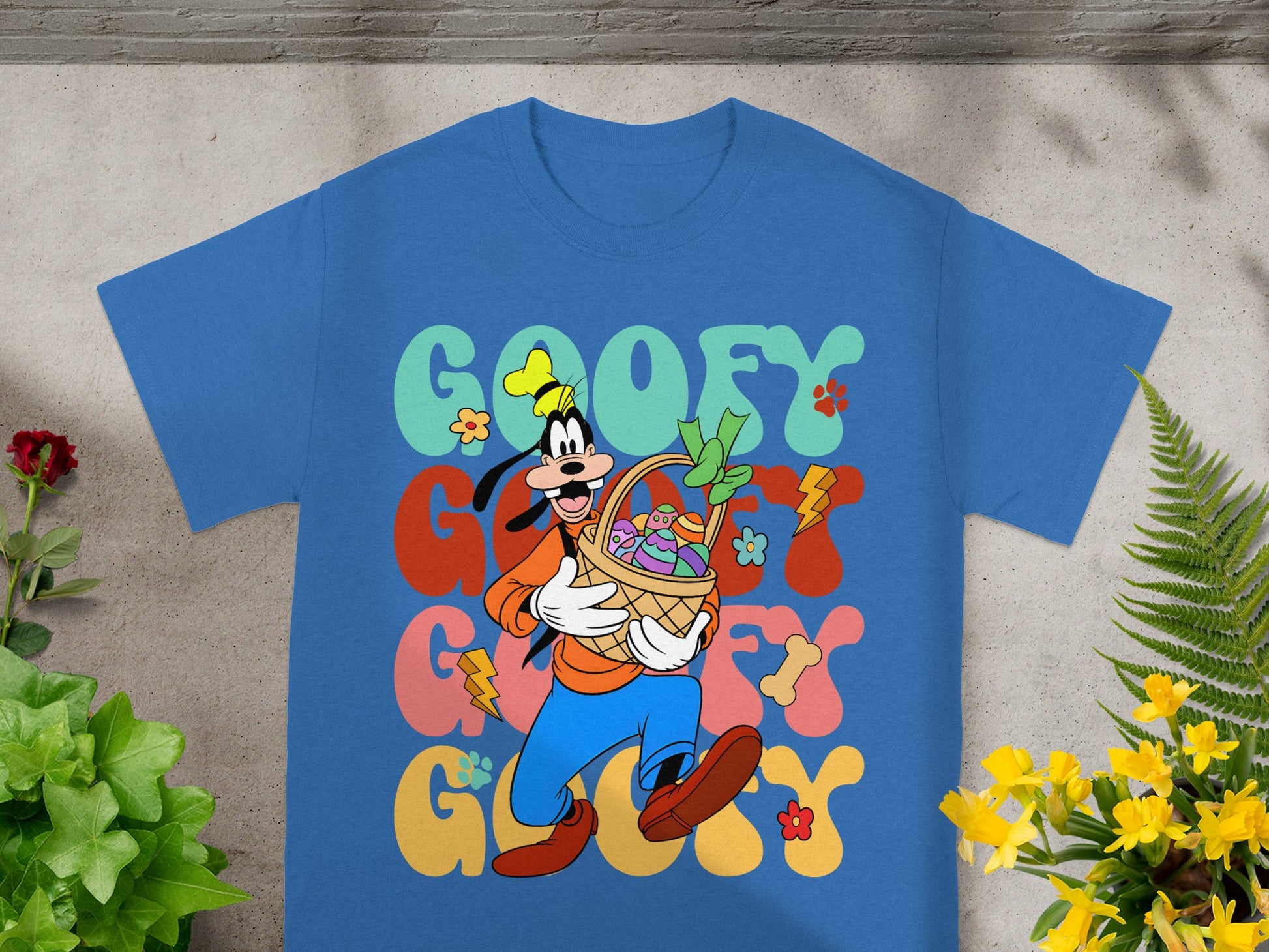 Goofy in blue pants carrying a basket of Easter eggs and flowers.