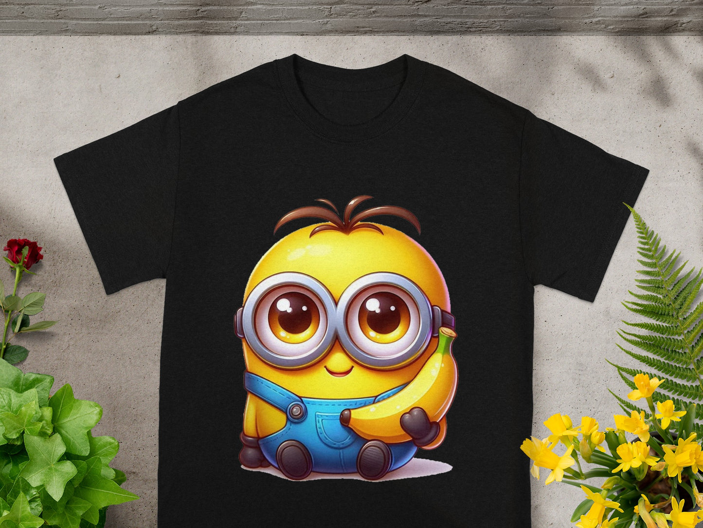 Black t-shirt featuring a cartoon Minion character holding a banana.