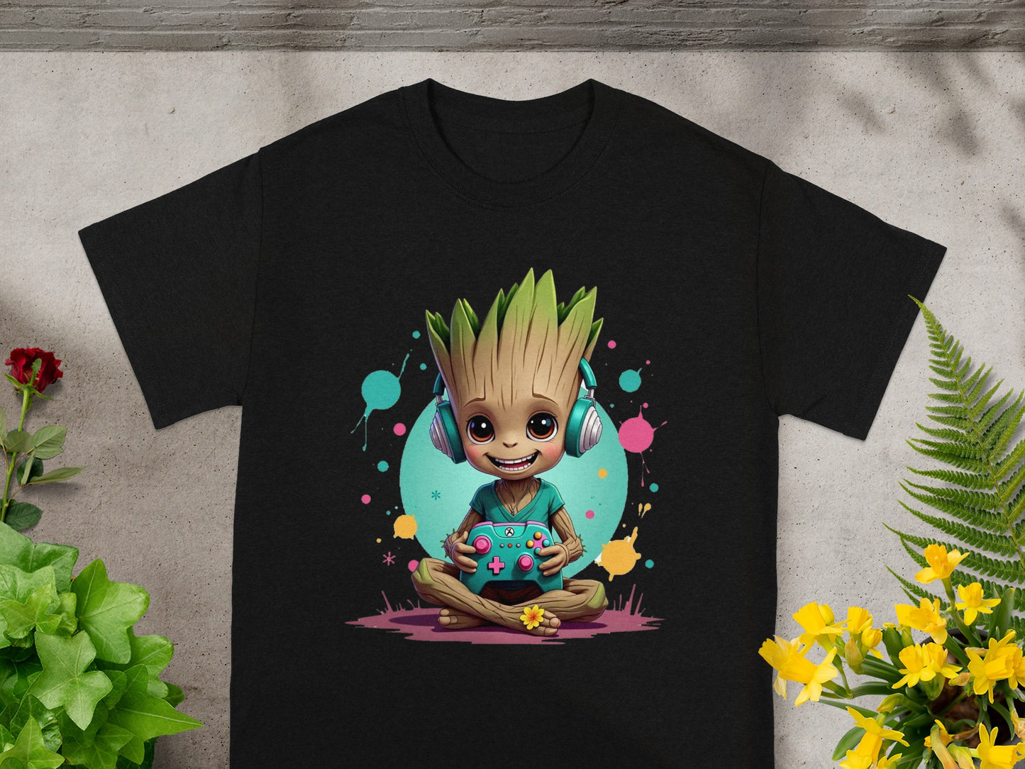 Groot wearing headphones, playing video games on a black t-shirt.