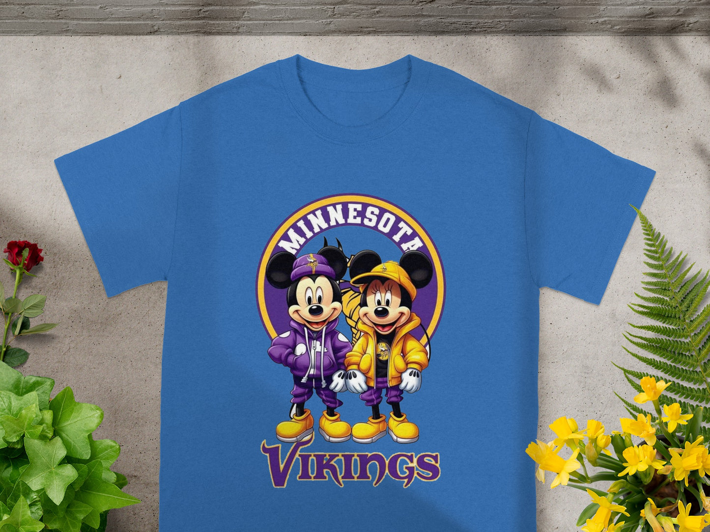 Mickey and Minnie Mouse in Minnesota Vikings jackets and hats.
