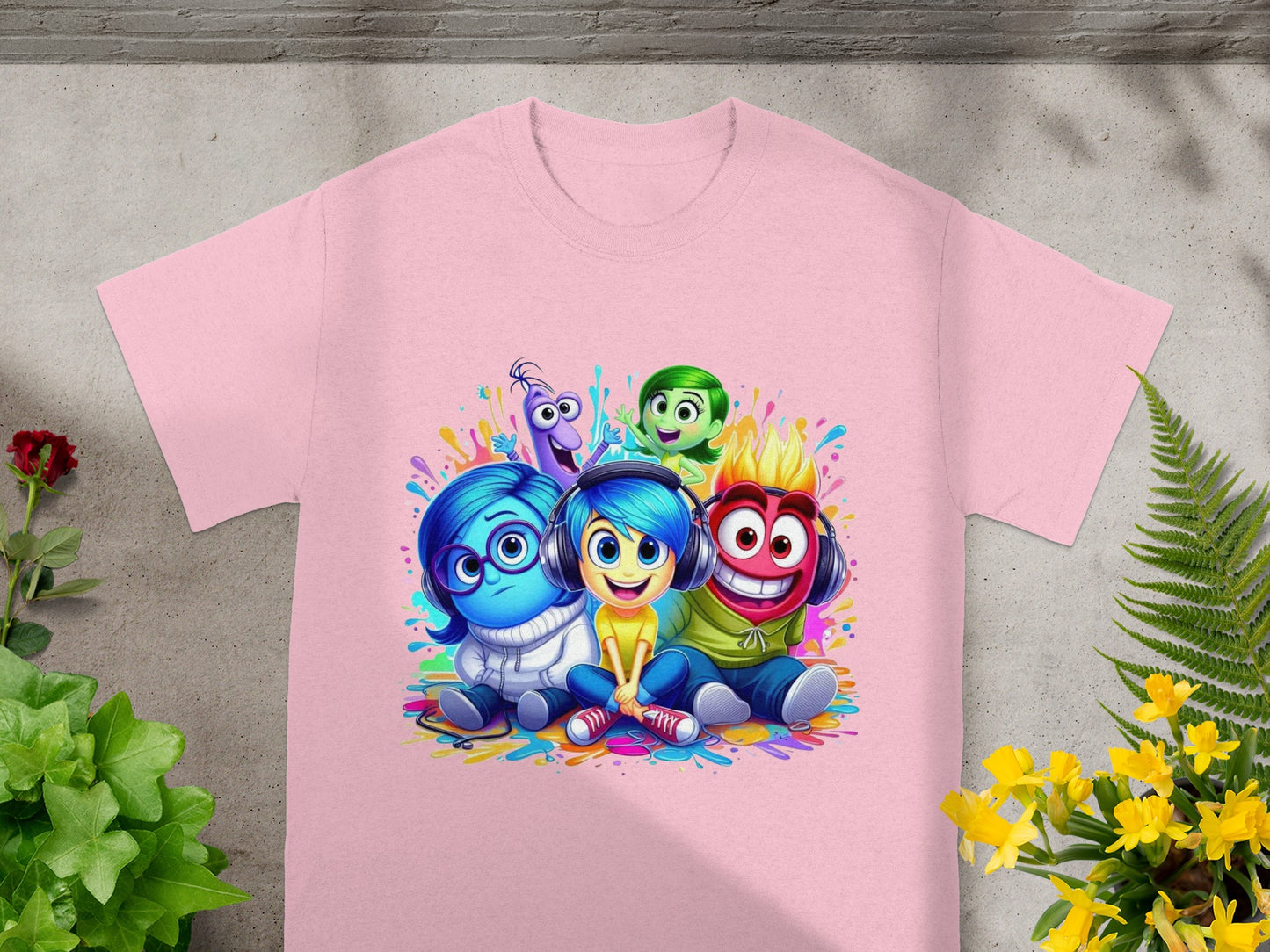 Joy, Sadness, Anger, Fear, and Disgust characters on a pink t-shirt.