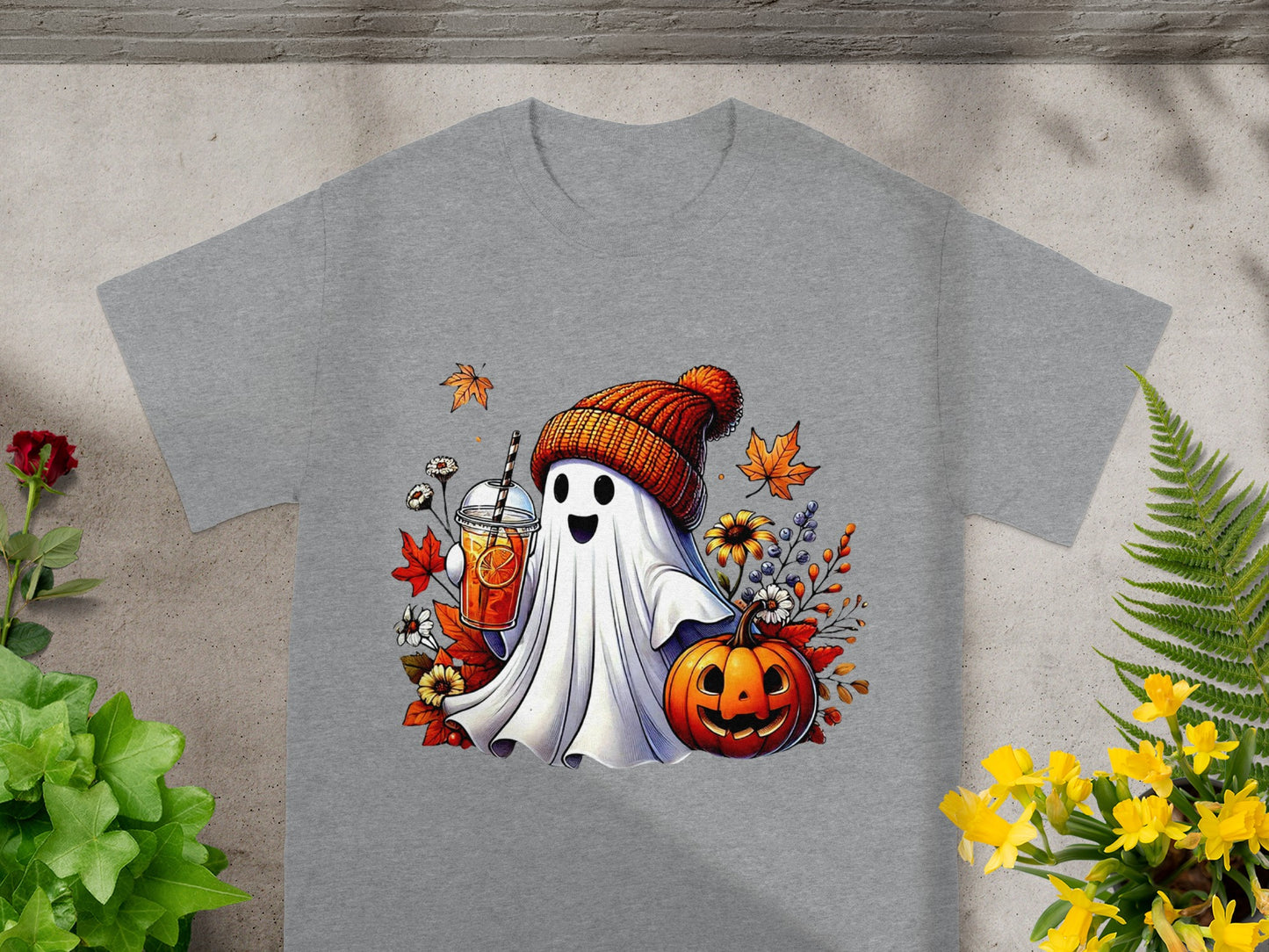 Ghost with pumpkin, drink, and autumn leaves graphic on a gray t-shirt.