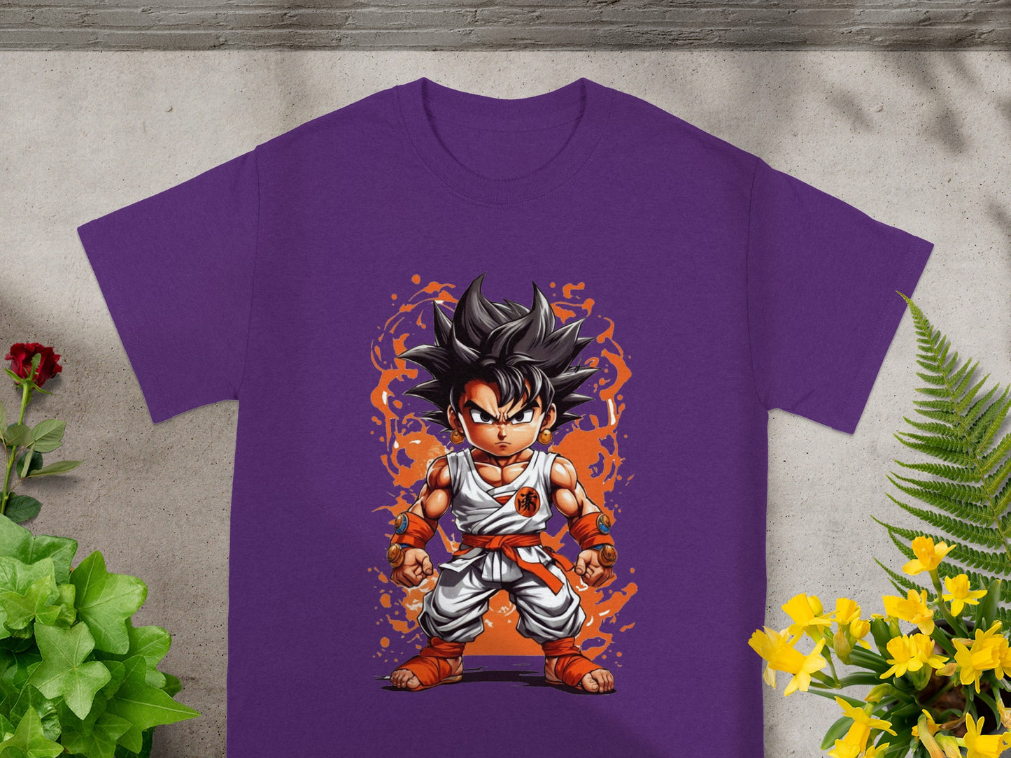 Goku in an action pose wearing a purple t-shirt with orange accents.