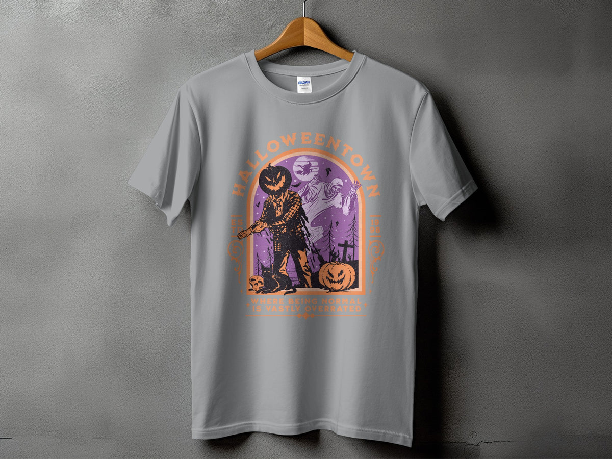 Grey t-shirt with Halloween graphic of scarecrow, ghost, and pumpkins with text.
