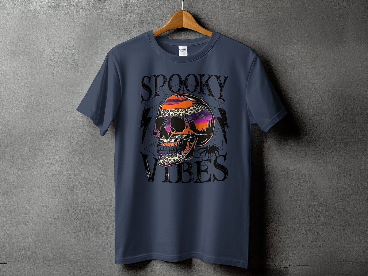 Blue t-shirt with "SPOOKY VIBES" text and a colorful skull graphic.