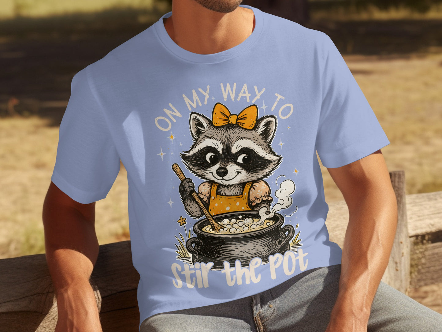 On My Way to Stir the Pot Raccoon Graphic Tee