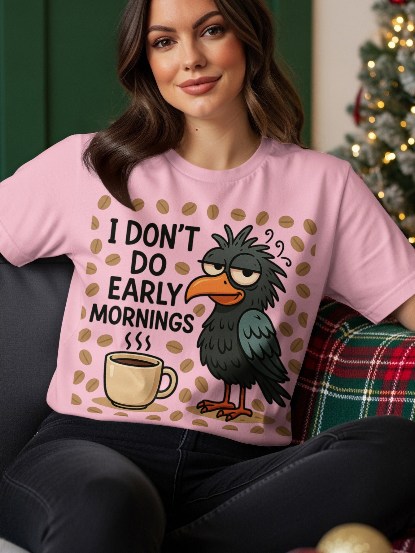 Black bird with tired eyes and coffee cup on pink t-shirt.