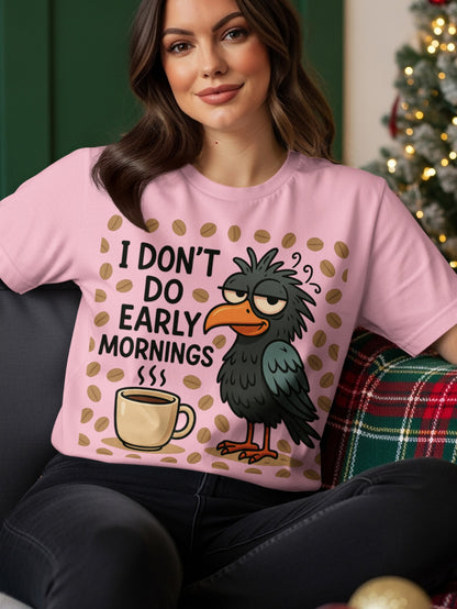 Black bird with tired eyes and coffee cup on pink t-shirt.