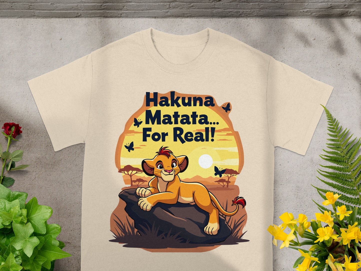 Hakuna Matata... For Real! text on a beige t-shirt with Simba character.