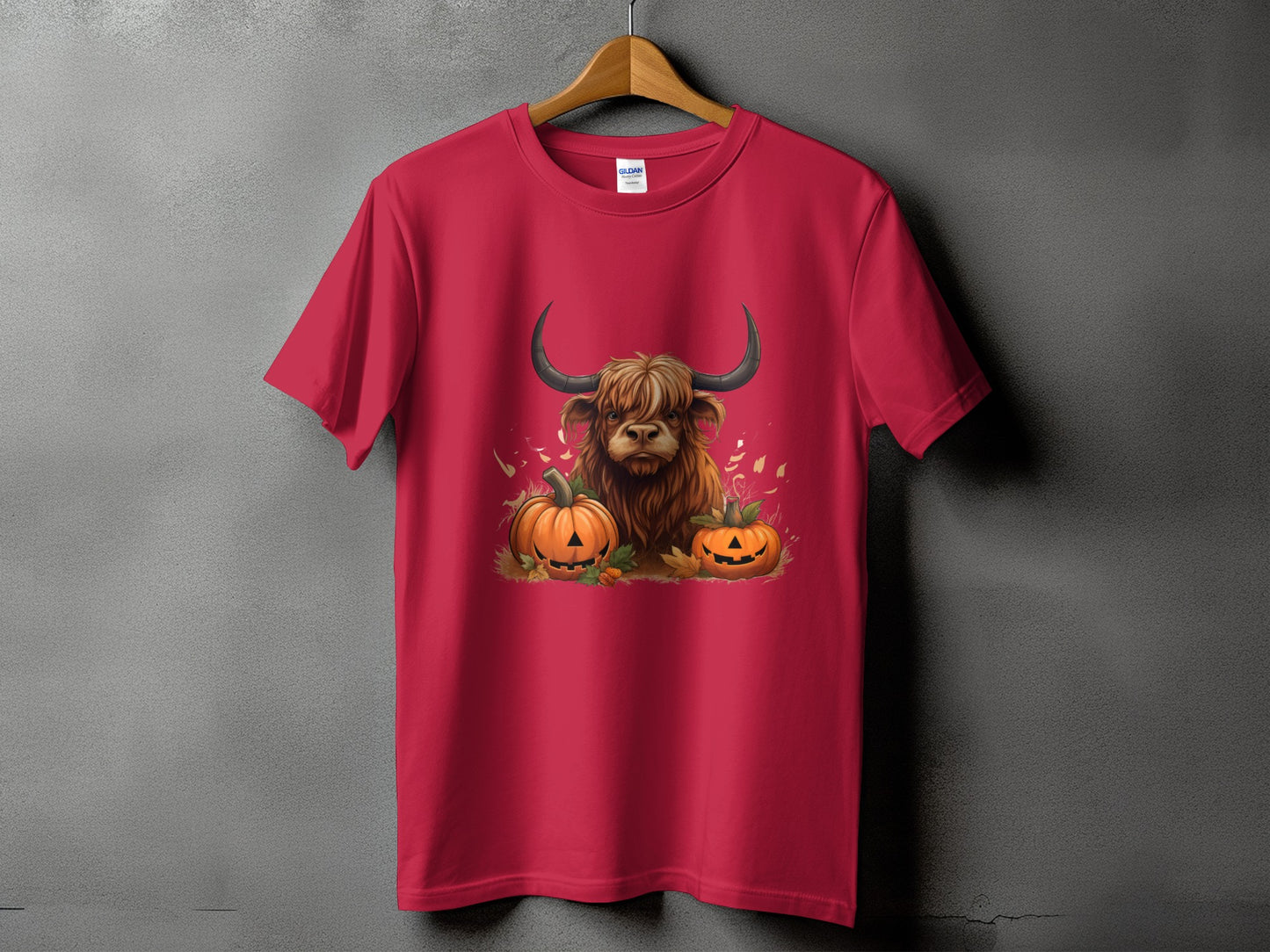 Red t-shirt with a highland cow and pumpkins graphic.