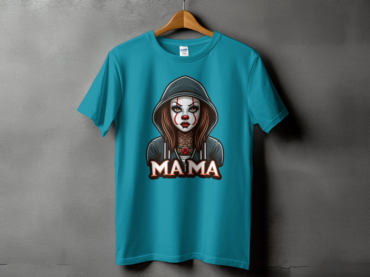 Teal t-shirt with a hooded, clown-faced woman and the word "MAMA".