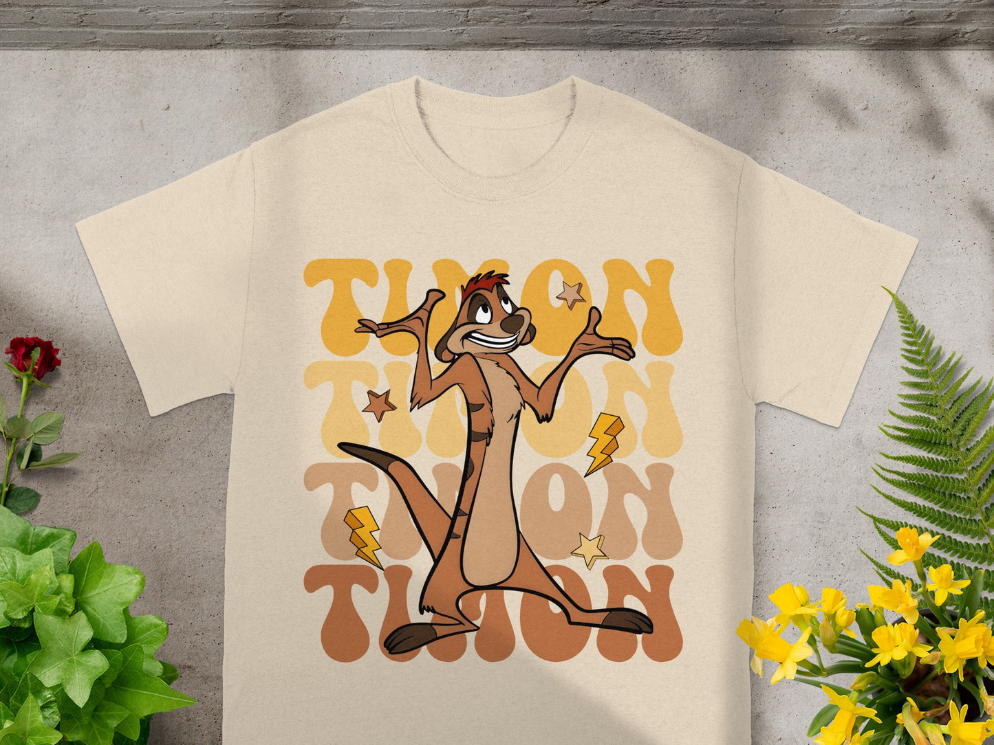 Timon from The Lion King wearing a t-shirt with brown text.
