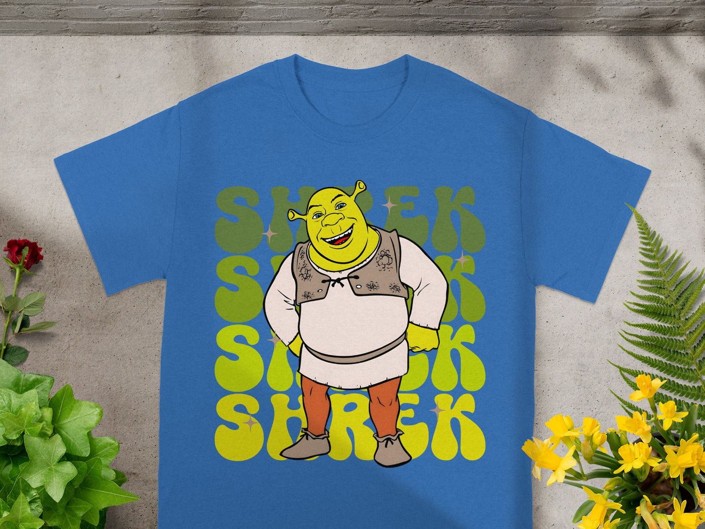Blue t-shirt with cartoon Shrek character and retro "Shrek" text.