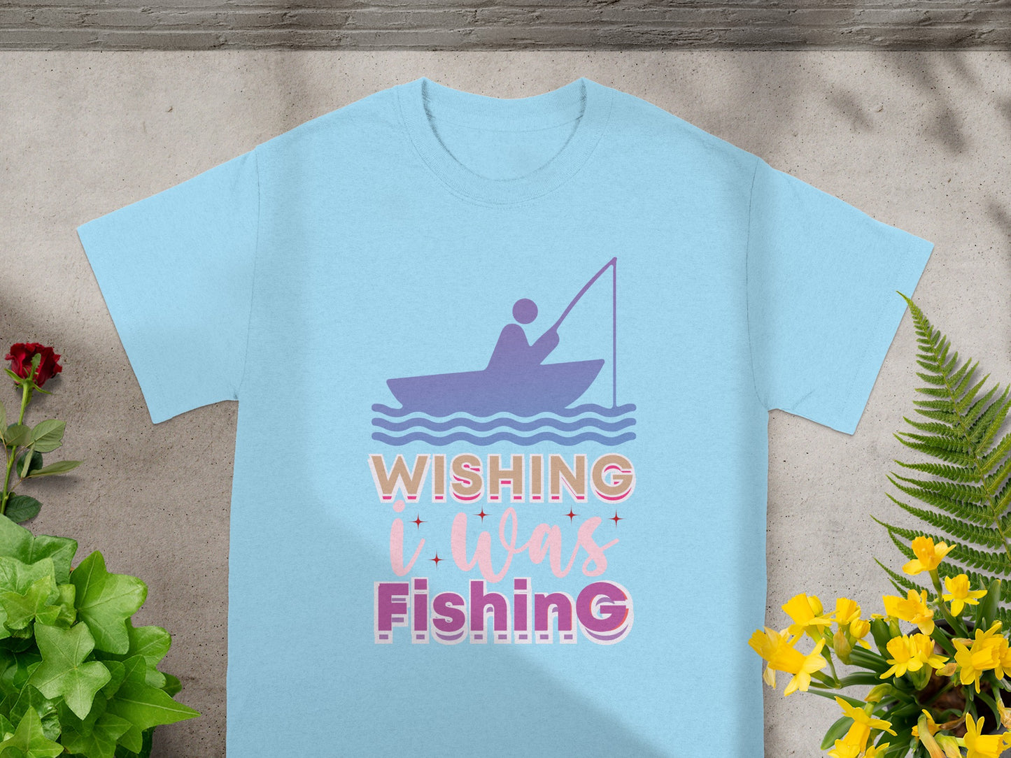 Light blue t-shirt with "Wishing It Was Fishing" graphic and a fisherman in a boat illustration.