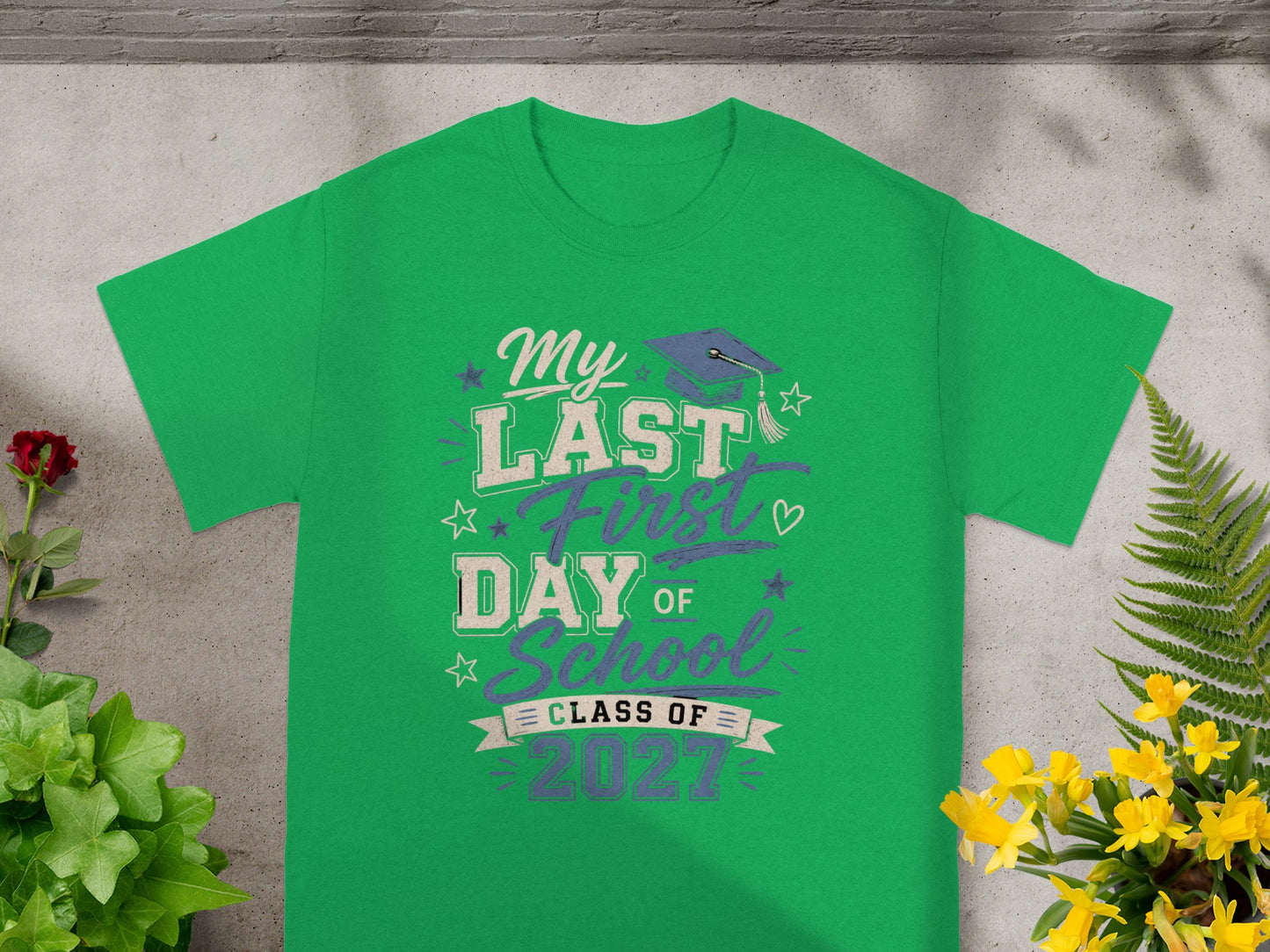 Green t-shirt with "My Last First Day of School Class of 2027" text and graduation cap.