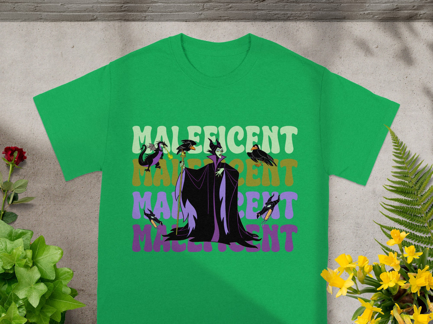 Green t-shirt with Maleficent graphic and text.