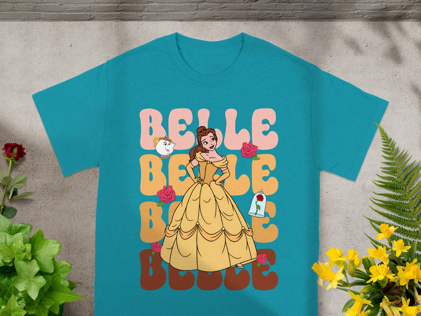 Belle in yellow dress with roses, "Belle" text design on turquoise t-shirt.