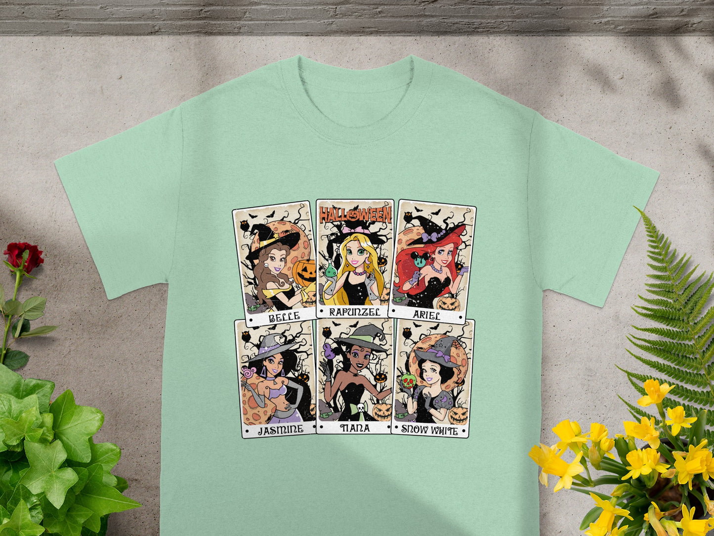Six Disney princesses in witch costumes with Halloween pumpkins and bats.