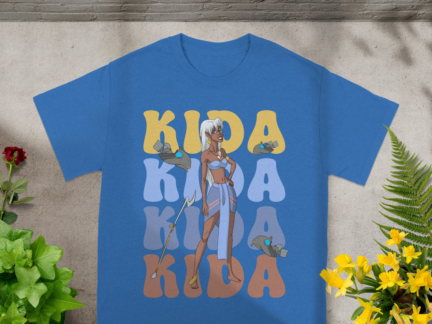 Blue t-shirt with "Kida" text and illustration of the character Kida.