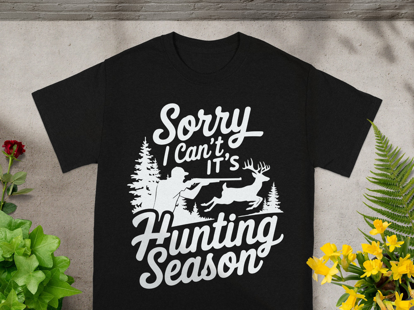 Black t-shirt with "Sorry I Can't It's Hunting Season" text and hunting graphic.