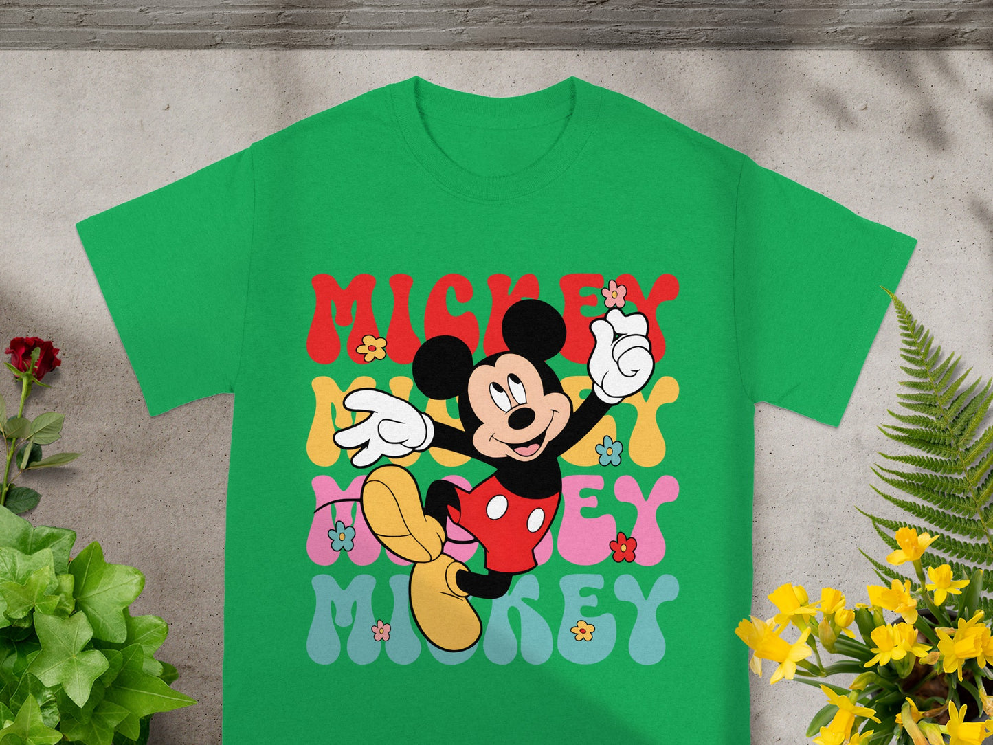 Green t-shirt with Mickey Mouse and "Mickey Mickey" text and flowers.