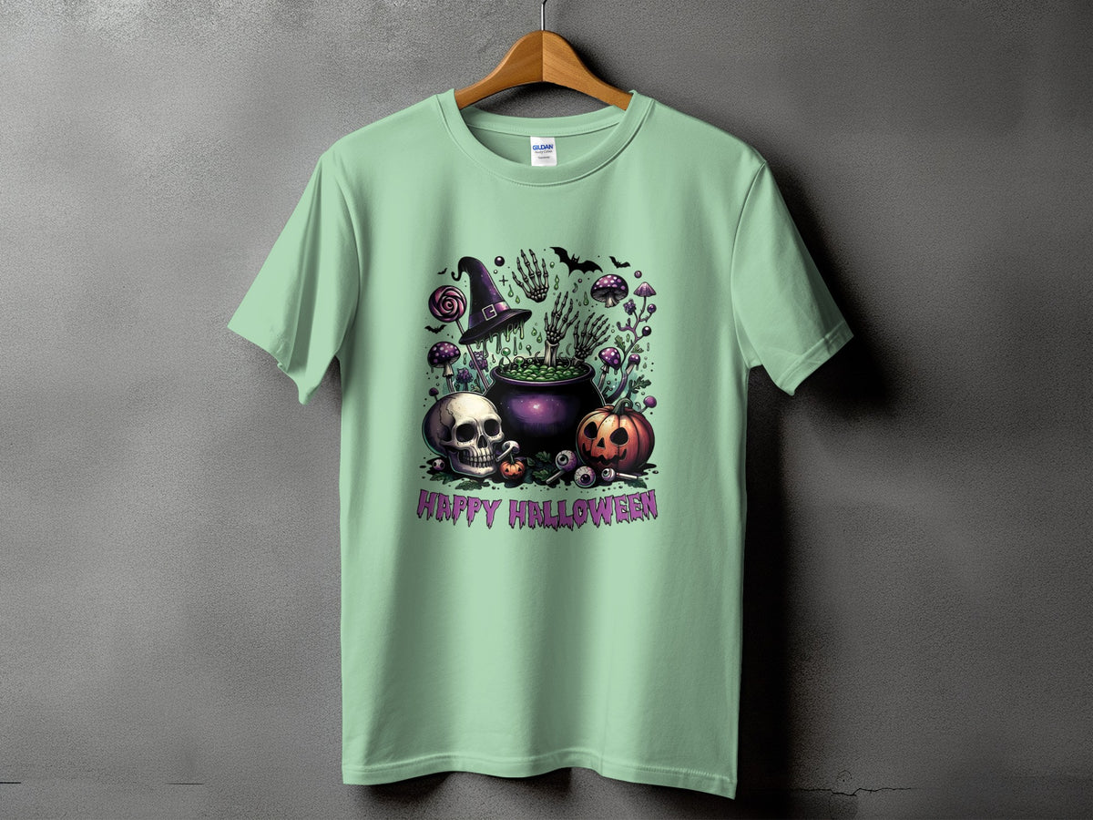 Green t-shirt with Halloween graphic featuring cauldron, skull, pumpkin, and text.