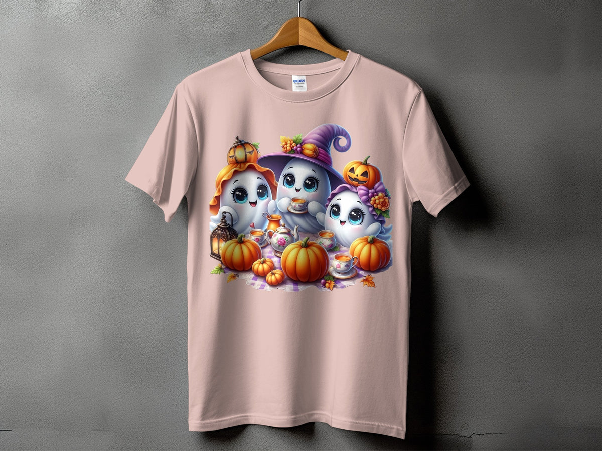 Three cute ghosts with pumpkins and a teapot on a pink t-shirt.