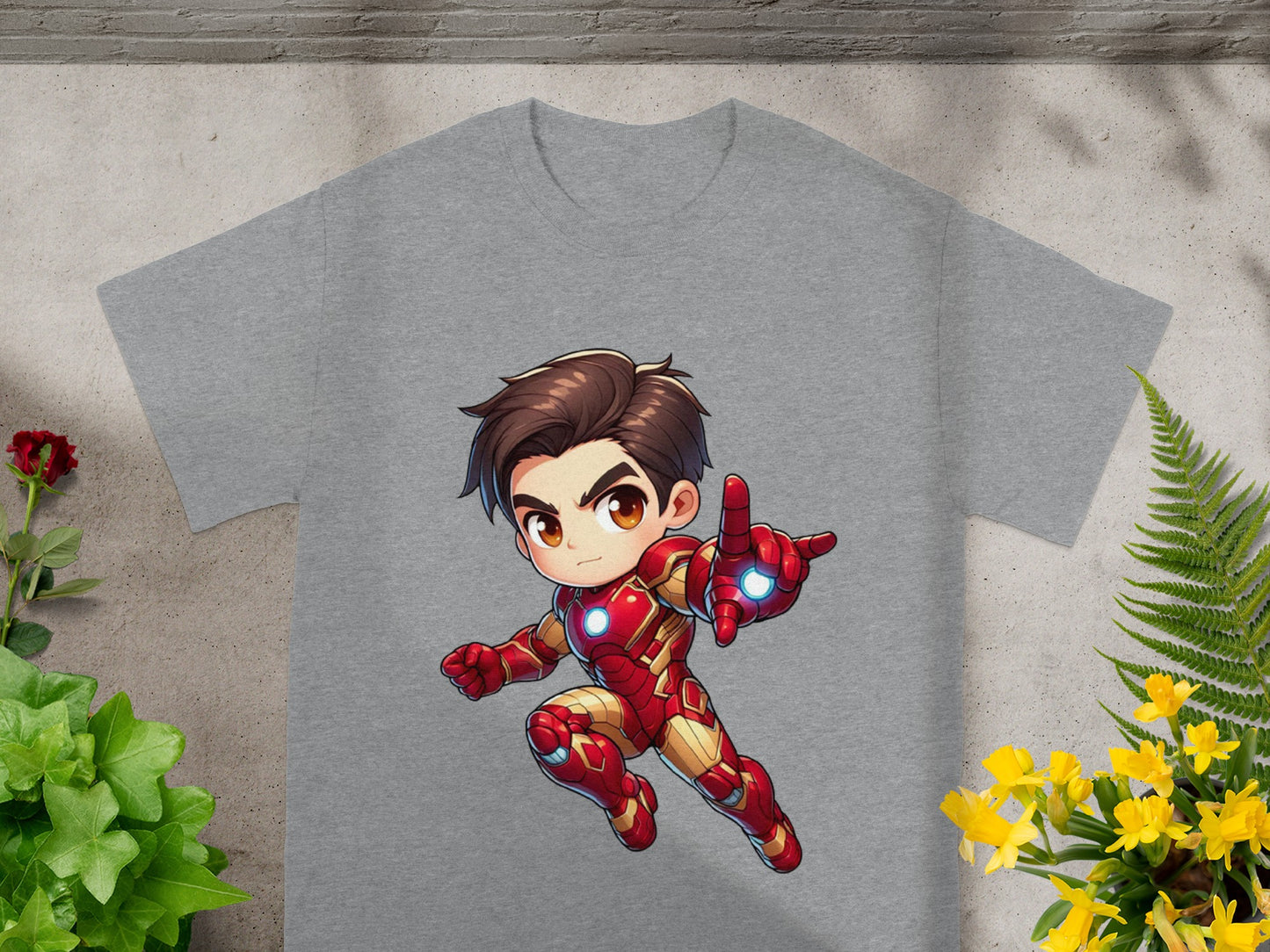 Chibi Iron Man in red and gold suit with thumb up, on grey t-shirt.