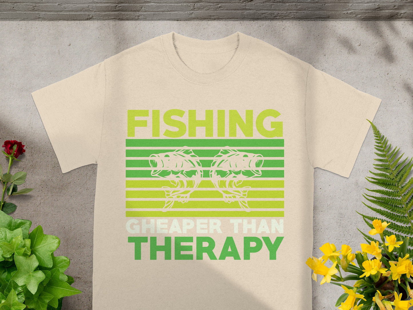 Beige t-shirt with "FISHING CHEAPER THAN THERAPY" text and fish graphic.