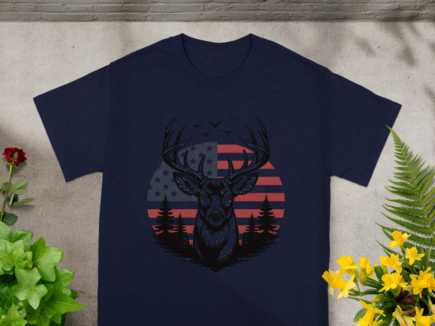 Deer head silhouette with American flag and trees on a navy t-shirt.