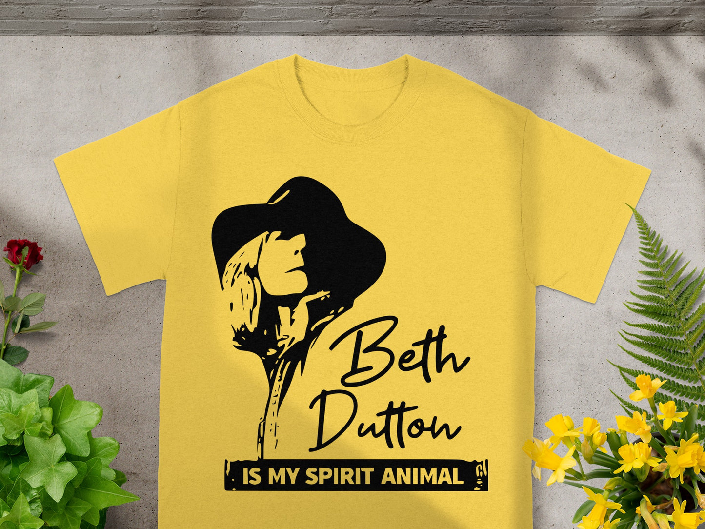 Yellow t-shirt with Beth Dutton graphic and "IS MY SPIRIT ANIMAL" text.