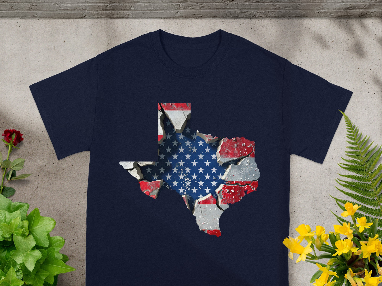 Dark navy t-shirt with a cracked Texas map graphic featuring the American flag.