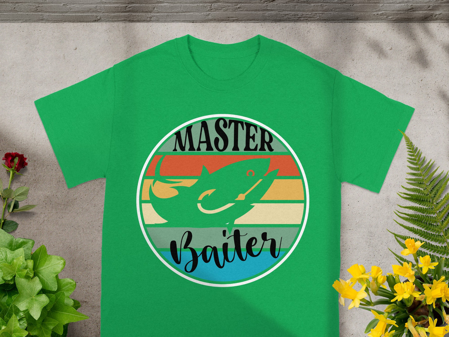 Green t-shirt with circle graphic of a fish and text: Master Baiter.