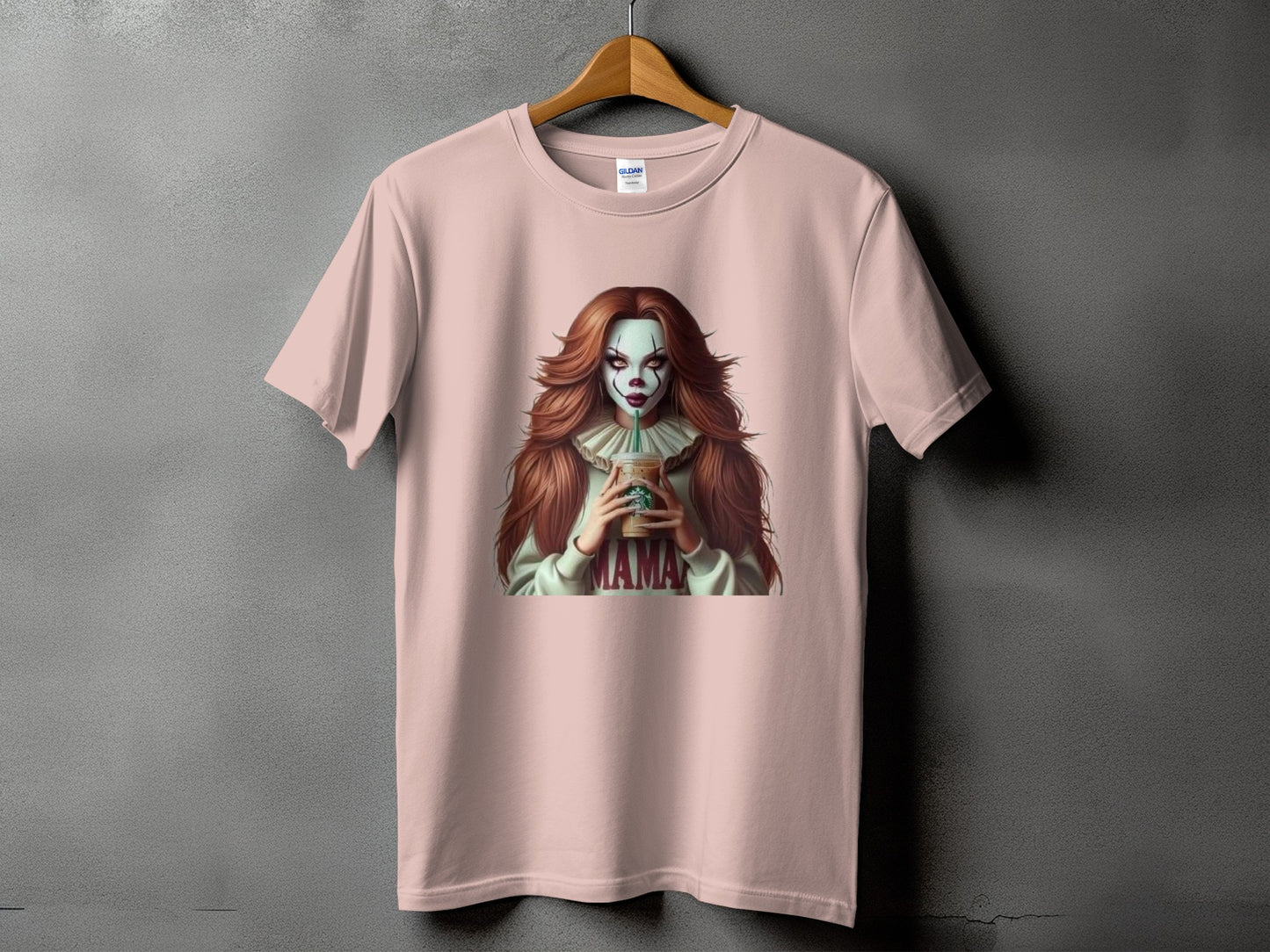 Pink t-shirt with illustration of a clown woman holding a Starbucks cup, text "MAMA".