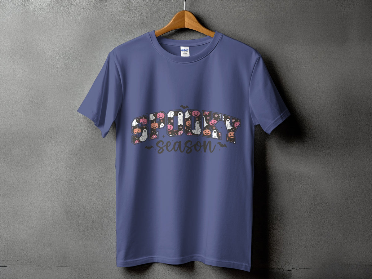 Purple t-shirt with "Spooky Season" text featuring pumpkins and ghosts.