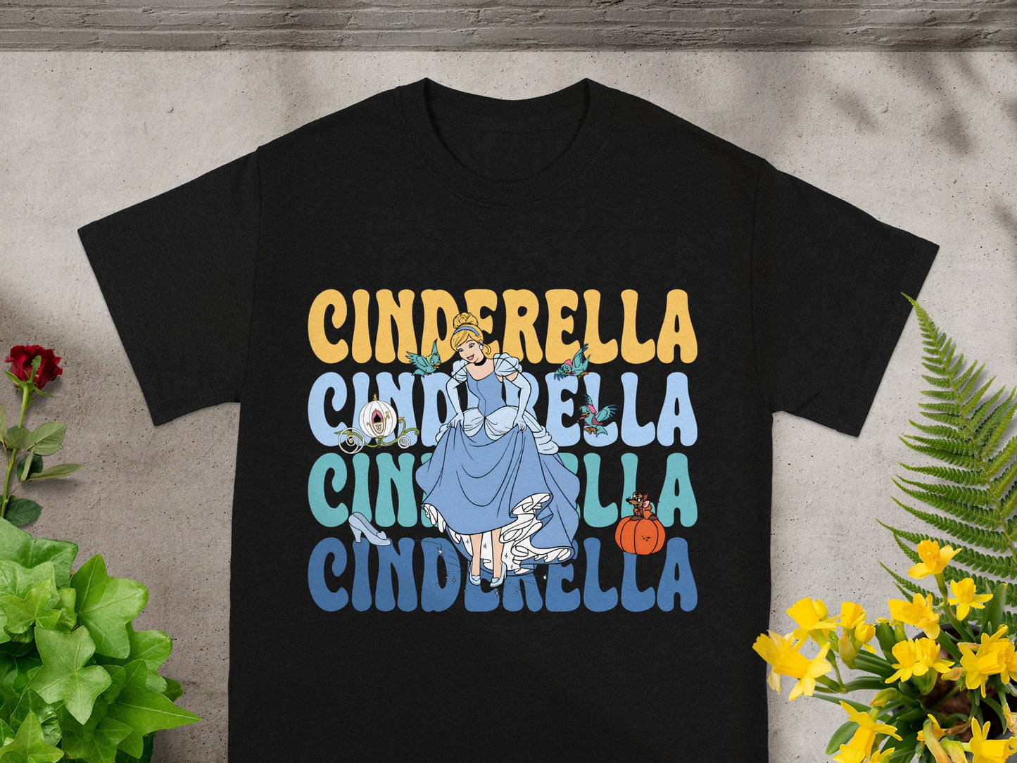 Black t-shirt with Cinderella graphic and repeated "Cinderella" text.