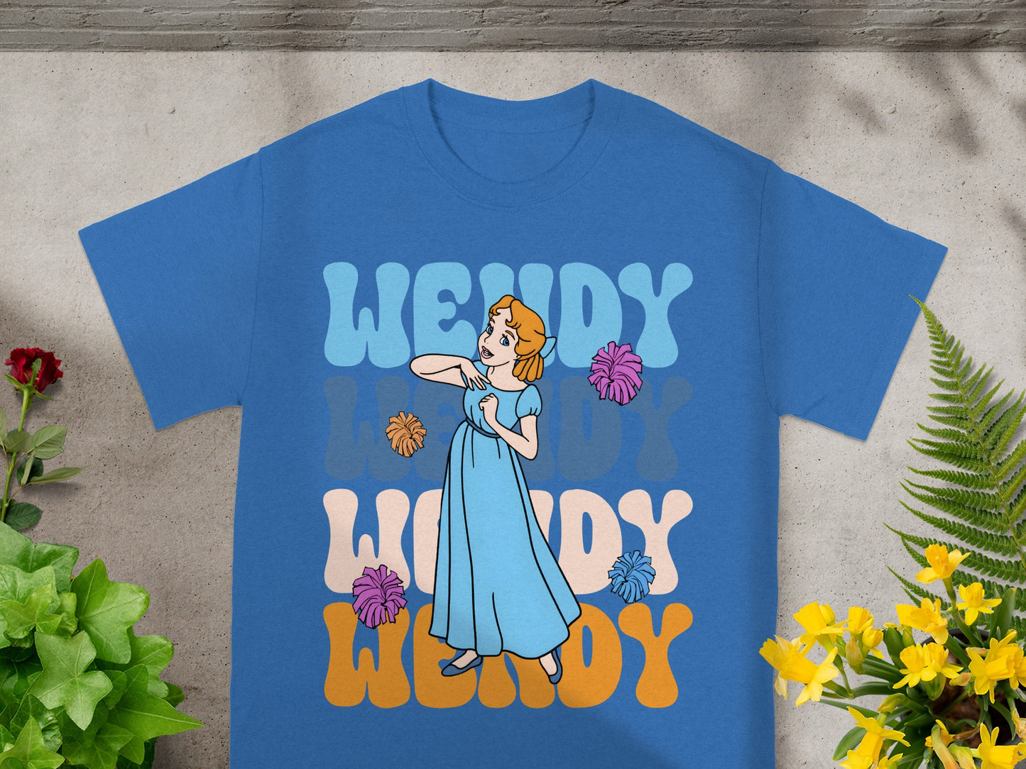 Blue t-shirt with a cartoon girl and "WENDY" text.