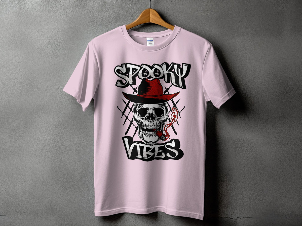 Pink t-shirt with "Spooky Vibes" text and a skull wearing a hat smoking a cigar.