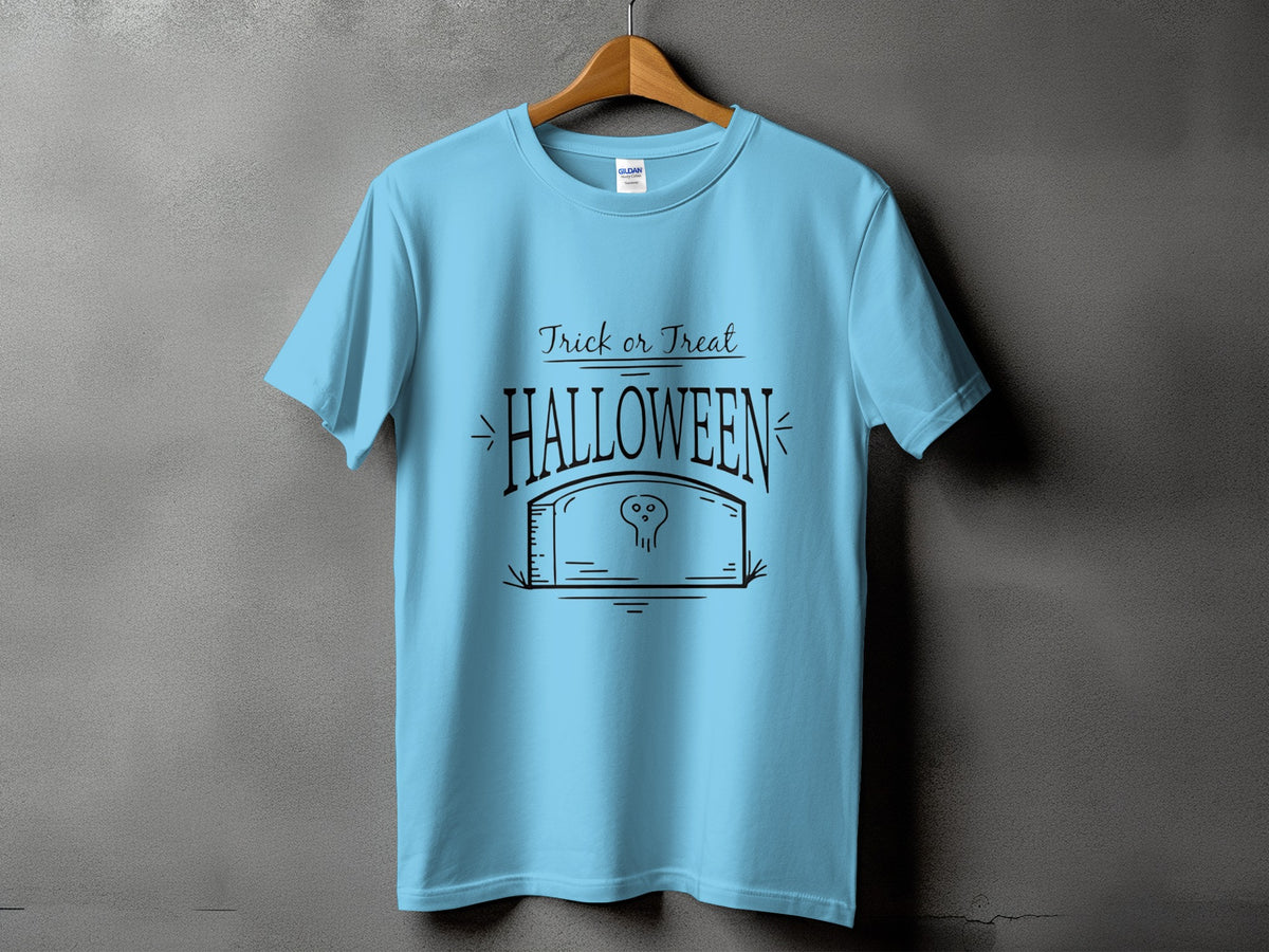 Light blue t-shirt with black Halloween graphic featuring "Trick or Treat" and a tombstone with a skull.