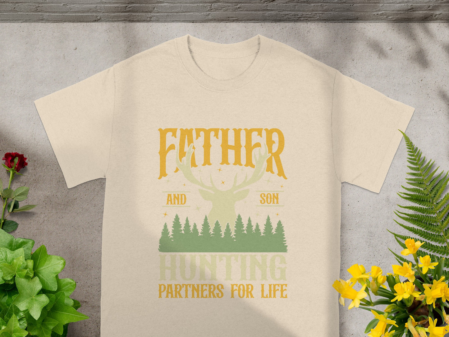 Light t-shirt with "Father and Son Hunting Partners for Life" text and woodland graphic.