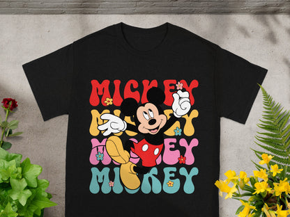 Black t-shirt with "Mickey" in colorful retro lettering and Mickey Mouse graphic.
