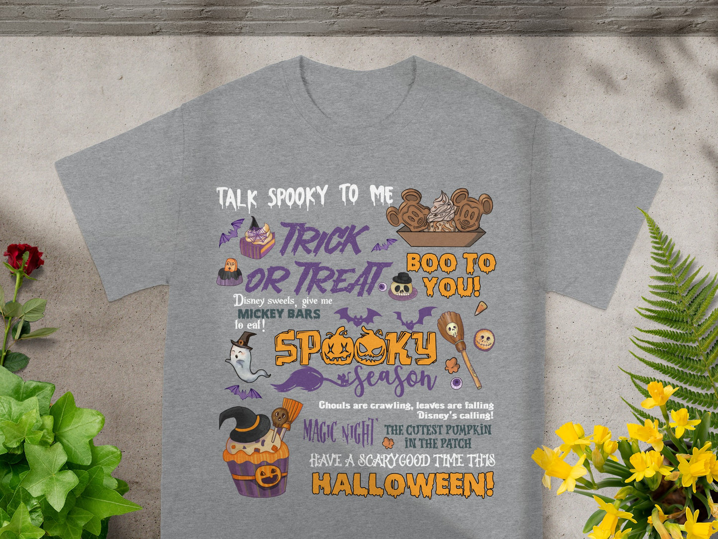 Grey t-shirt with Halloween-themed Disney graphics and text.