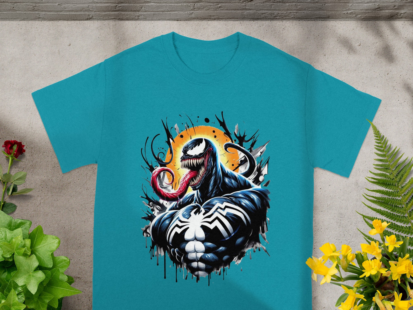 Turquoise t-shirt featuring Venom with a splashing ink effect.