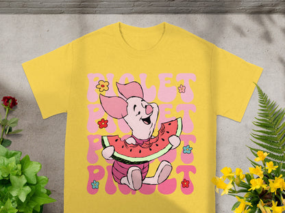 Piglet eating watermelon on a yellow t-shirt with "Violet Pink" text.