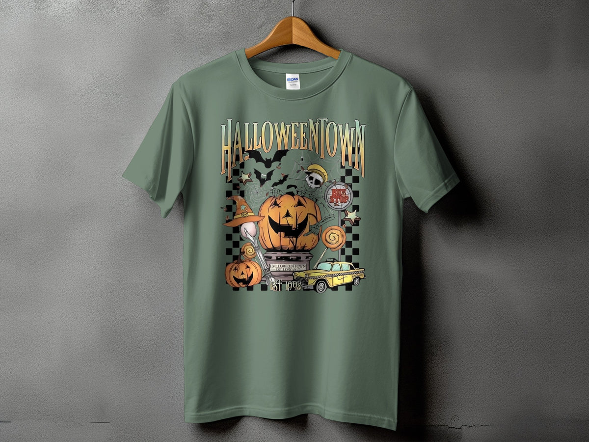 Green t-shirt with Halloweentown graphic featuring pumpkins, bats, and a yellow taxi.